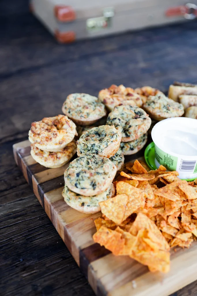 Gourmet charcuterie board featuring biltong, crackers, grapes, and pomegranate at a Free State hunting retreat.